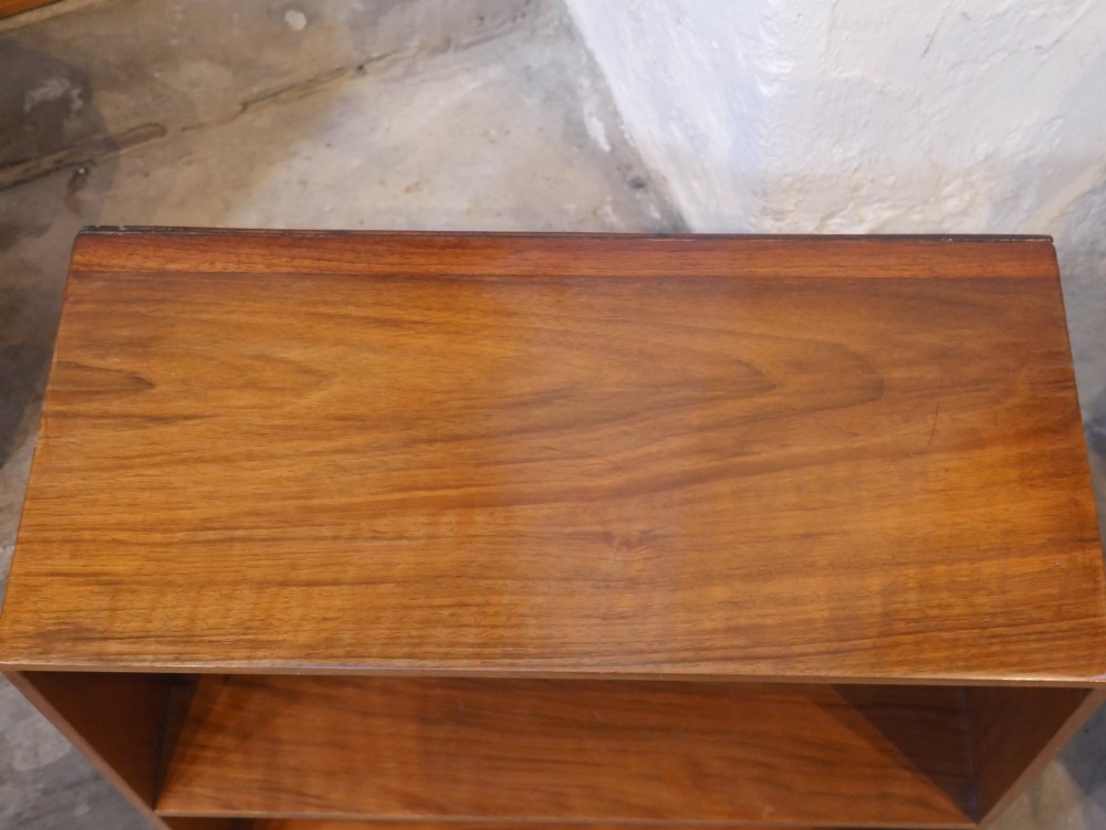 A group of three rectilinear open wooden display boxes with warm timber grain. View VII