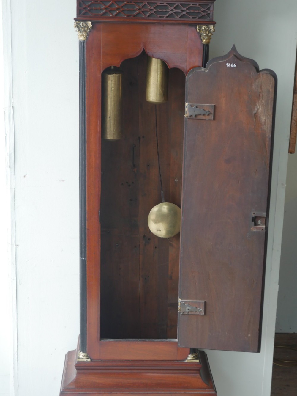 A tall Scottish mahogany longcase clock featuring a swan-neck pediment with brass finials, fretwork details, and an brass dial with silvered chapter ring. View VIII