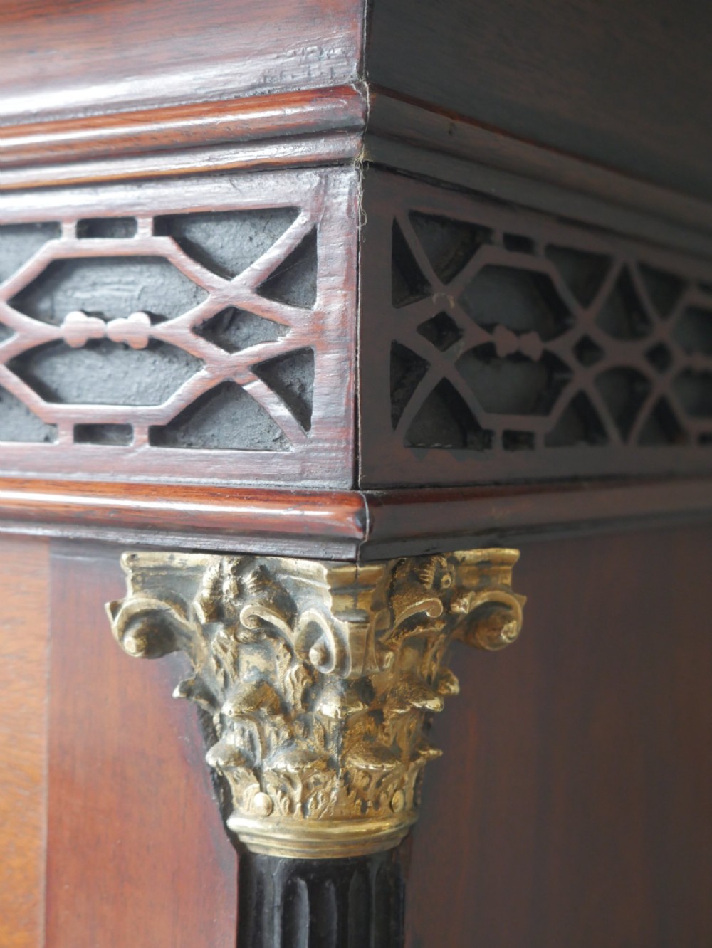 A tall Scottish mahogany longcase clock featuring a swan-neck pediment with brass finials, fretwork details, and an brass dial with silvered chapter ring. View X