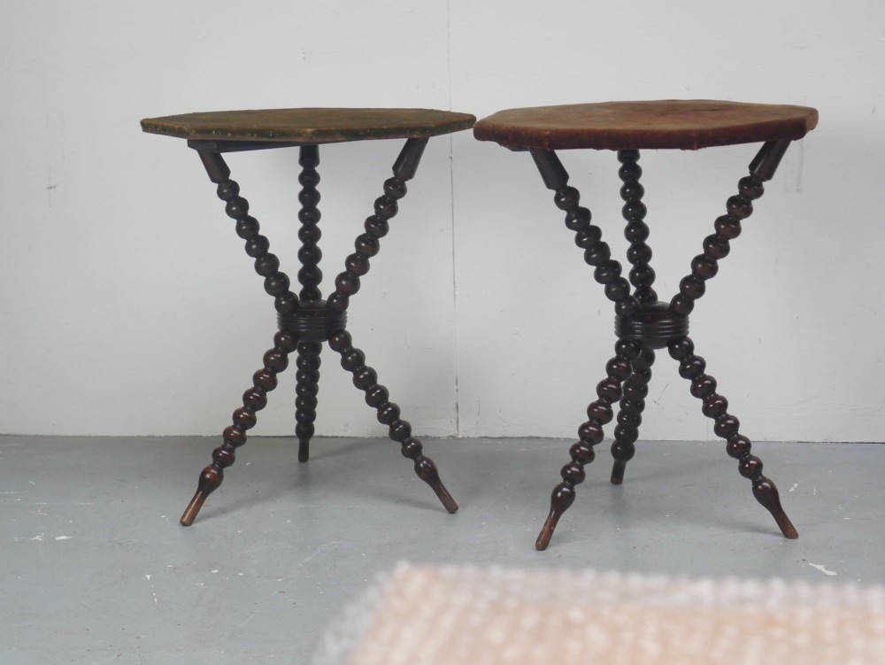 A pair of Victorian gypsy side tables featuring dark bobbin-turned tripod legs and octagonal fabric-covered tops in green and red. View II