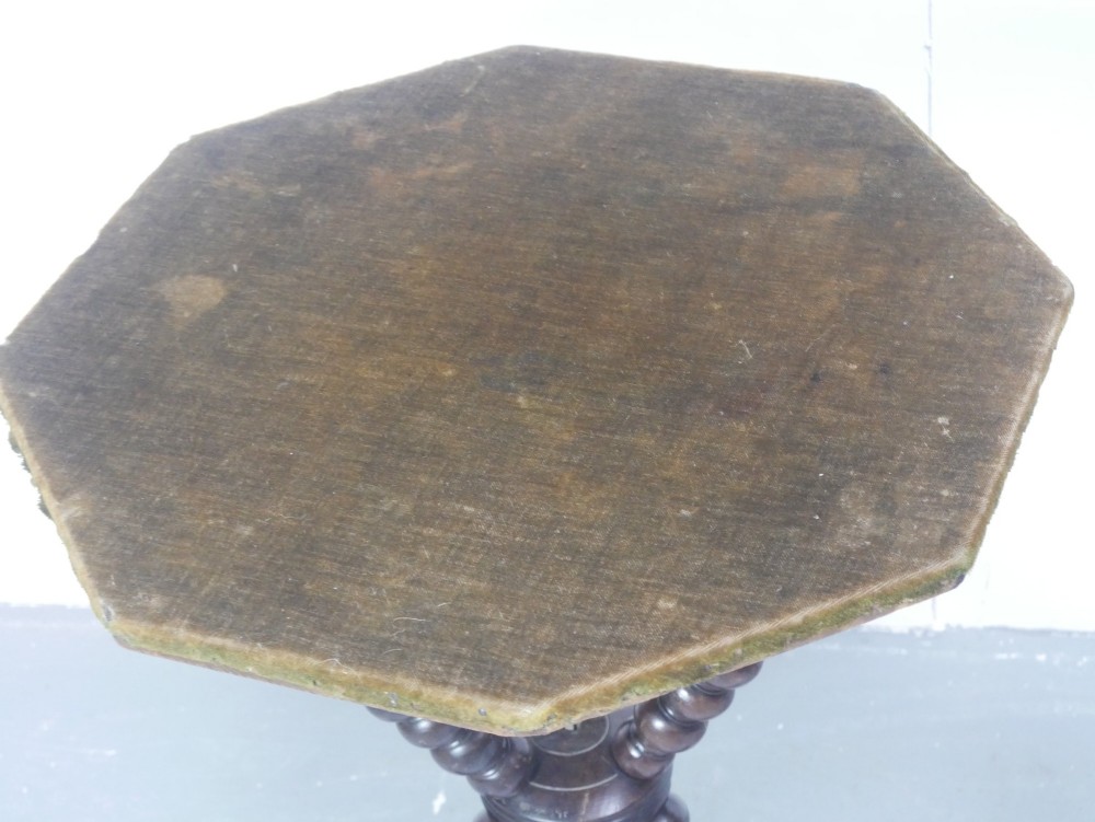 A pair of Victorian gypsy side tables featuring dark bobbin-turned tripod legs and octagonal fabric-covered tops in green and red. View V