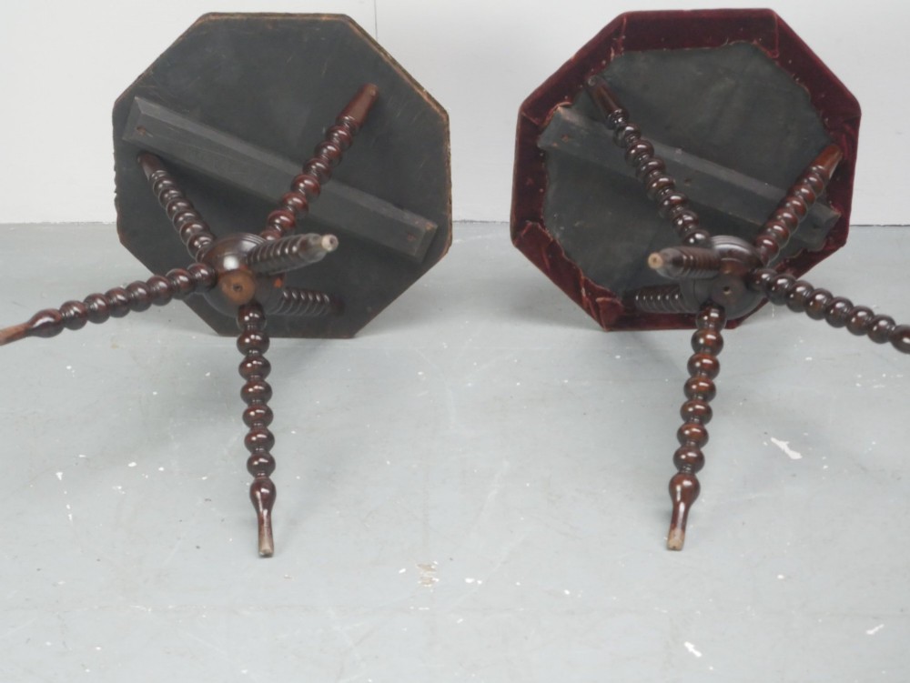 A pair of Victorian gypsy side tables featuring dark bobbin-turned tripod legs and octagonal fabric-covered tops in green and red. View VI