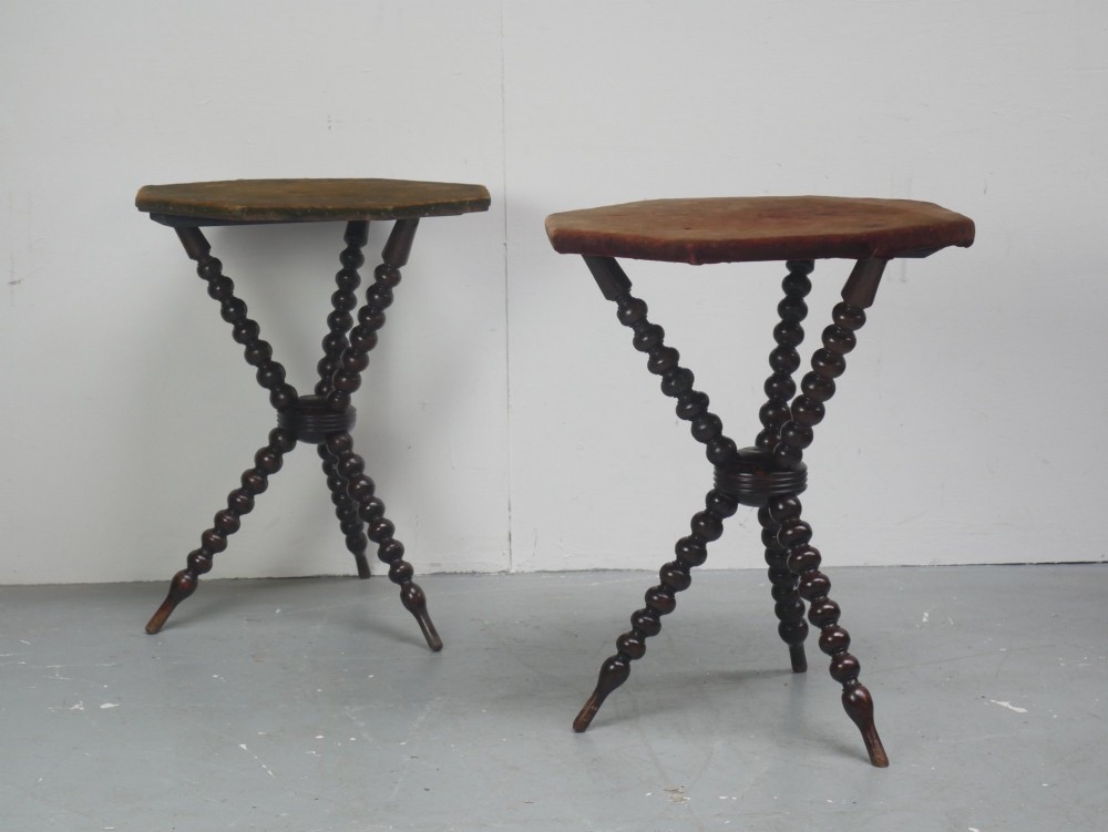 A pair of Victorian gypsy side tables featuring dark bobbin-turned tripod legs and octagonal fabric-covered tops in green and red. View XII