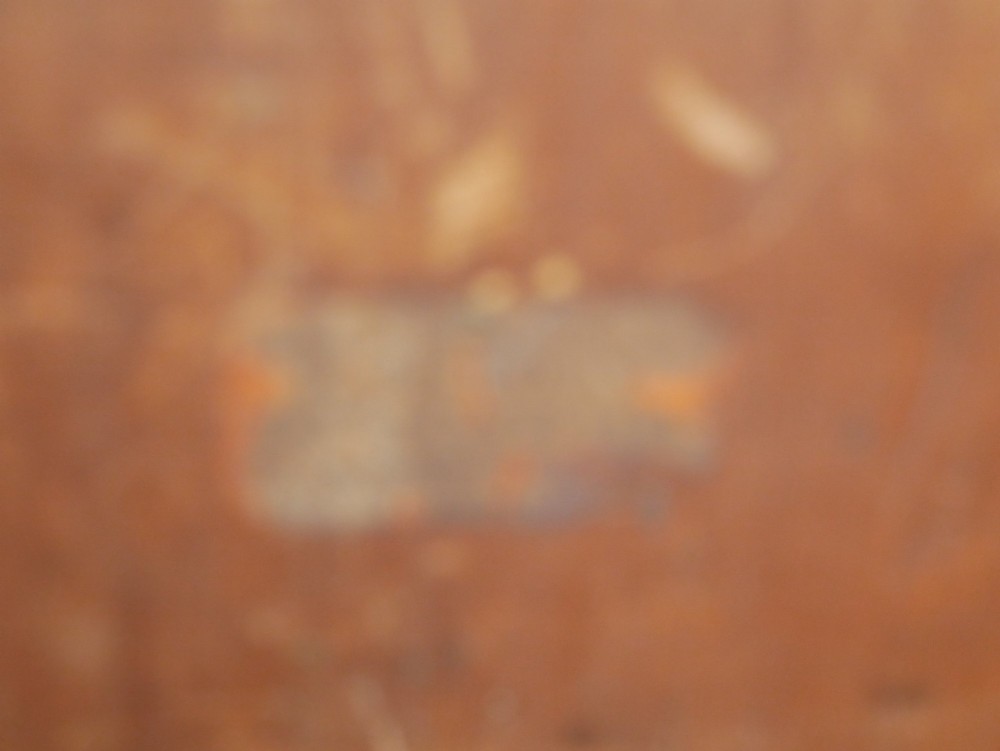 A miniature warm brown wooden chest of drawers featuring three graduated drawers with round knobs and a scalloped lower apron. View VII