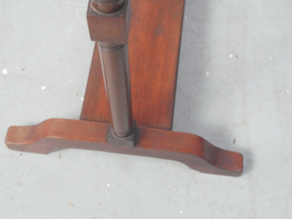 A dark mahogany freestanding towel rail featuring scrolled top terminals, turned vertical posts, and multiple horizontal drying bars supported on sledge feet. View V