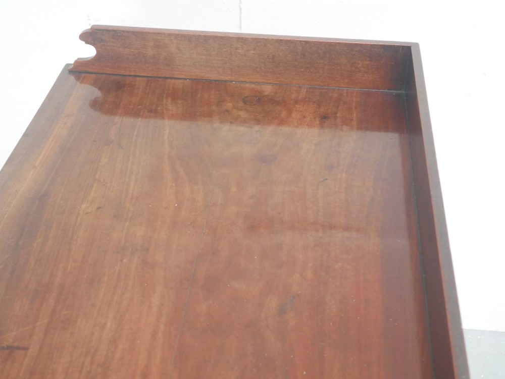 An antique Regency mahogany writing table featuring a raised gallery back, two frieze drawers with line inlay, and turned legs. View III