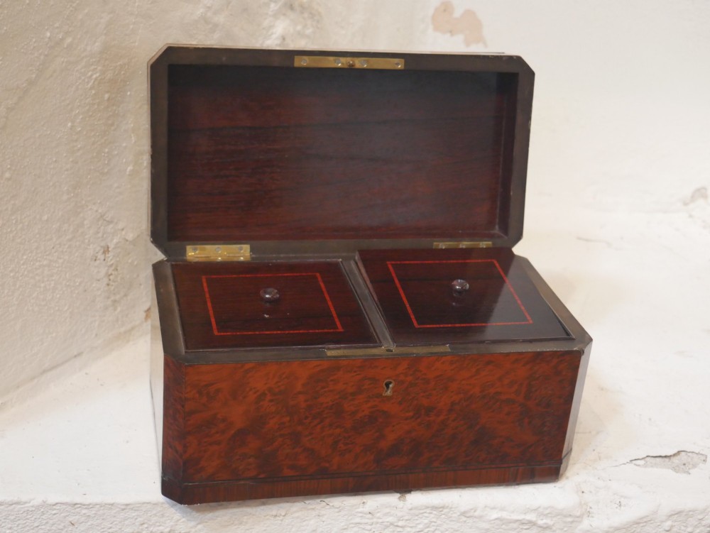 A 19th-century French amboyna wood box featuring canted corners, brass edging, and central brass inlay on the lid. View VI