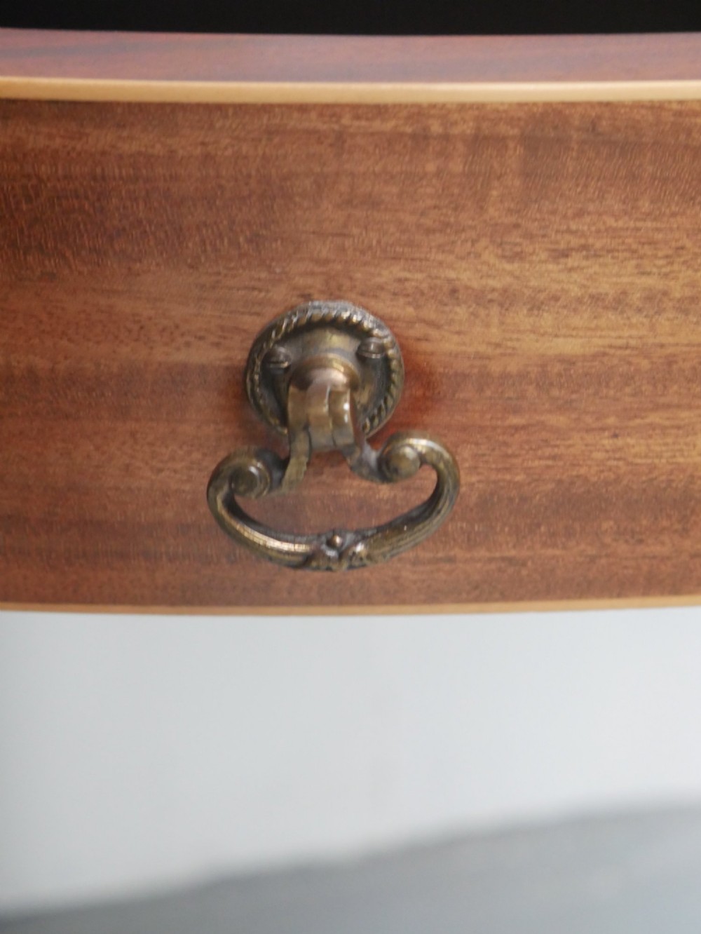 A Regency mahogany demi-lune console table featuring satinwood stringing inlay, a central drawer, and four square tapered legs. View VI