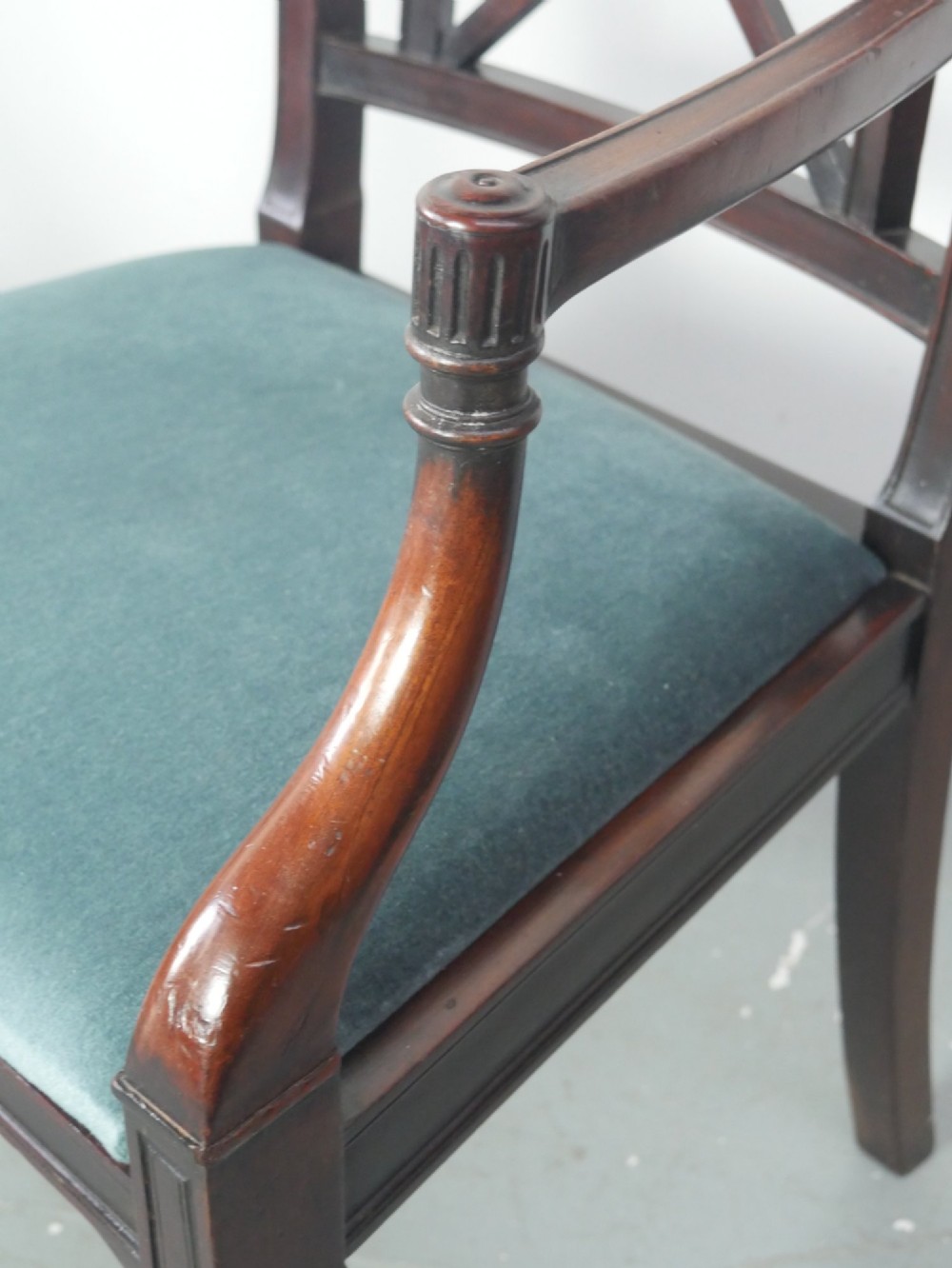 A pair of dark mahogany Regency Revival armchairs featuring cross-back splats, curved arms, and teal velvet upholstered seats. View IV