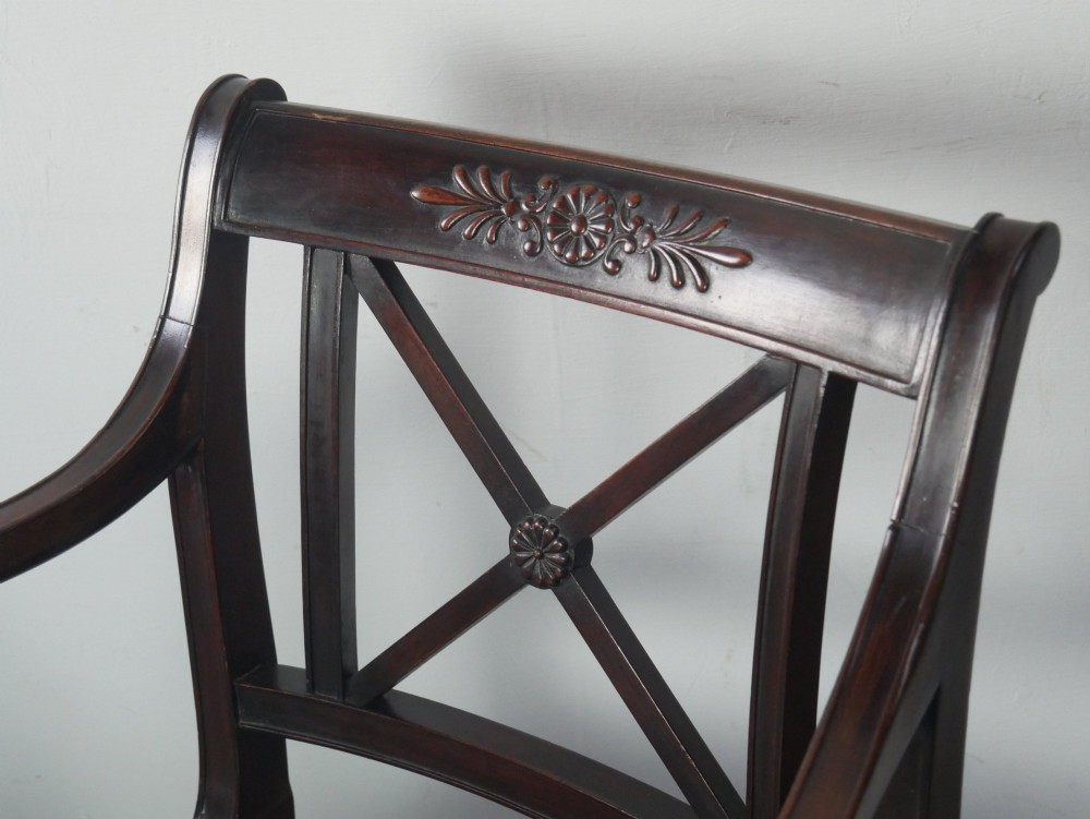 A pair of dark mahogany Regency Revival armchairs featuring cross-back splats, curved arms, and teal velvet upholstered seats. View V
