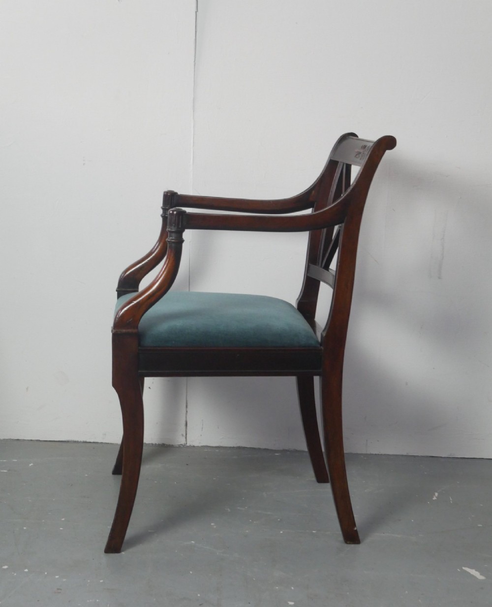 A pair of dark mahogany Regency Revival armchairs featuring cross-back splats, curved arms, and teal velvet upholstered seats. View VI