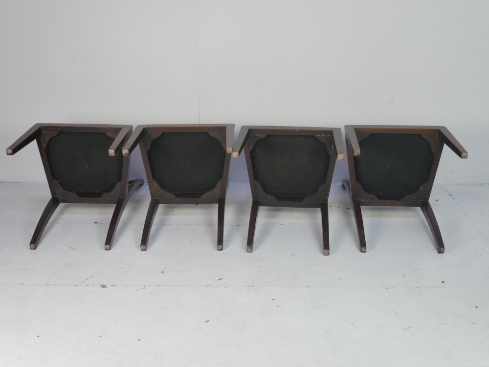 A set of six dark mahogany Georgian dining chairs featuring reeded backs and patterned needlepoint tapestry seats arranged on a neutral background. View VIII