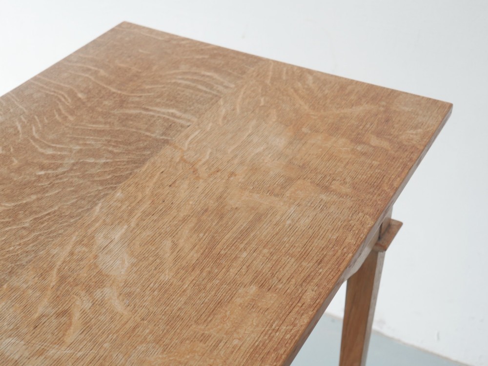 An Arts and Crafts oak lamp table featuring heart cut-out details on the apron, tapered square legs, and a contoured undertier shelf. View IV