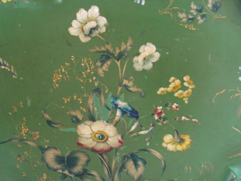 An antique 19th-century olive green painted metal toleware tray featuring a scalloped rim and hand-painted botanical flowers with gilded accents. View II