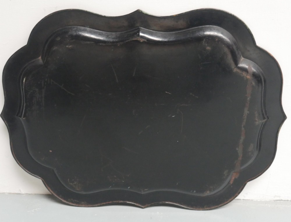 An antique 19th-century olive green painted metal toleware tray featuring a scalloped rim and hand-painted botanical flowers with gilded accents. View VII