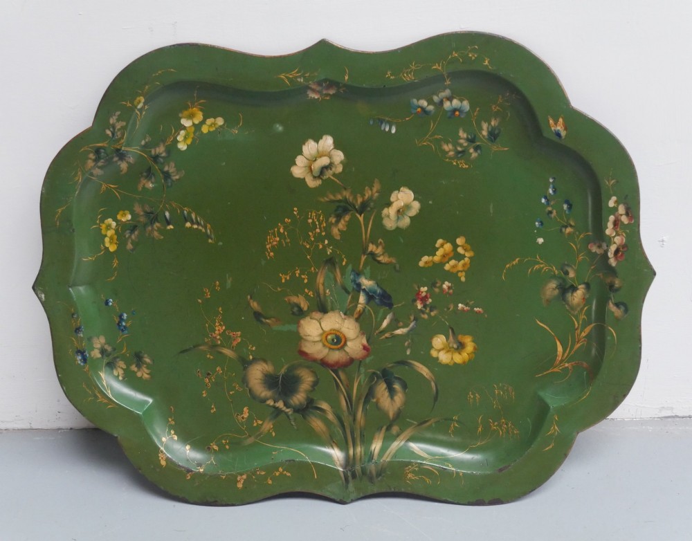 An antique 19th-century olive green painted metal toleware tray featuring a scalloped rim and hand-painted botanical flowers with gilded accents. View VIII