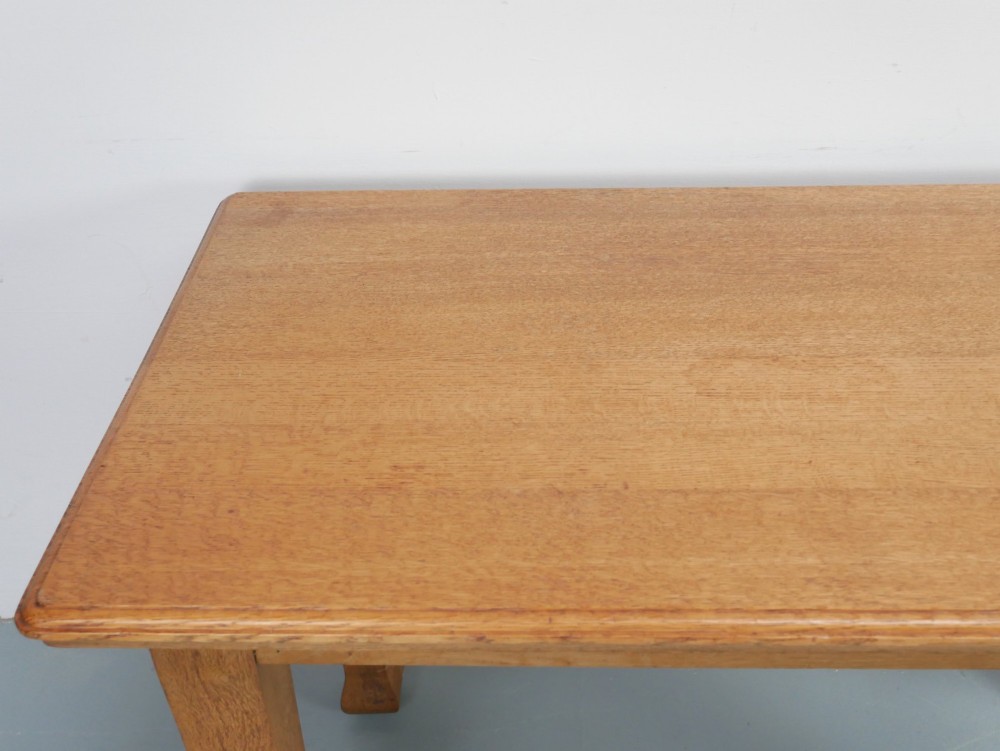 A rectangular solid oak kitchen dining table featuring shaped legs and a moulded edge top. View IV