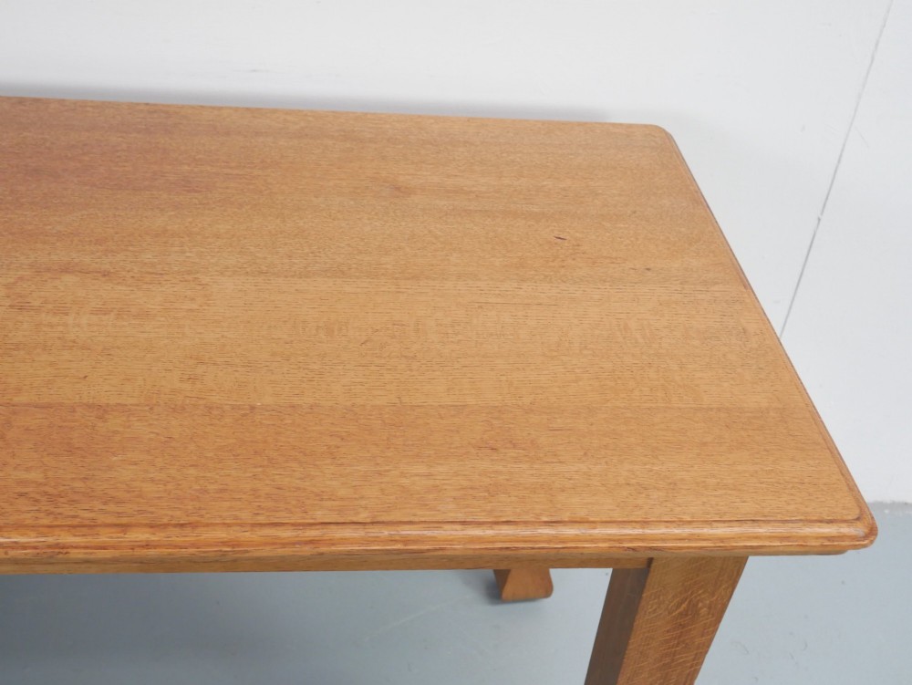 A rectangular solid oak kitchen dining table featuring shaped legs and a moulded edge top. View V