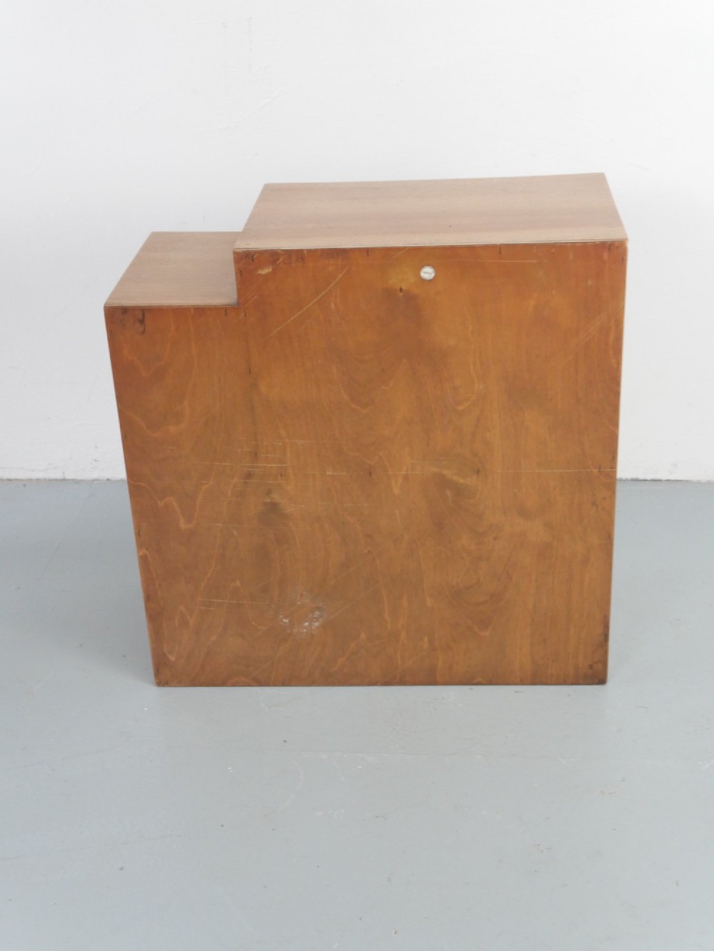 A mid-century open wooden side cabinet featuring asymmetrical shelving compartments and visible comb joints at the outer edges. View IV
