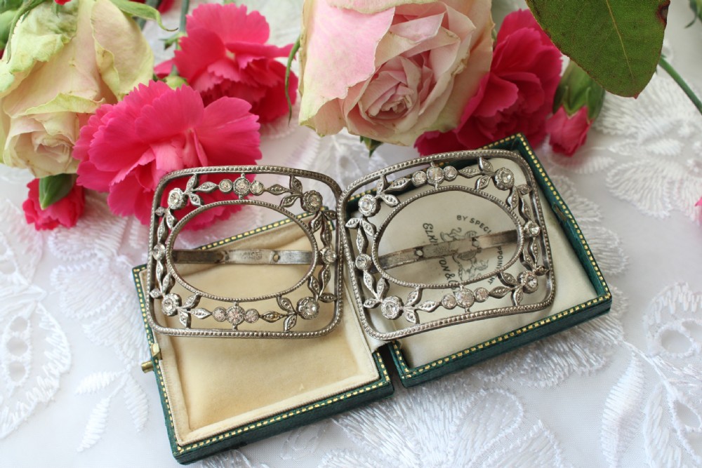 A pair of eighteenth-century Georgian paste glass and steel filigree shoe buckles in a fitted green velvet display box.