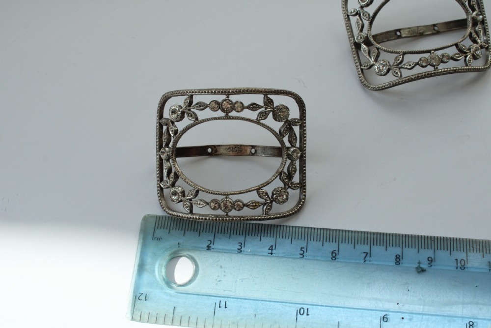 A pair of eighteenth-century Georgian paste glass and steel filigree shoe buckles in a fitted green velvet display box. View V