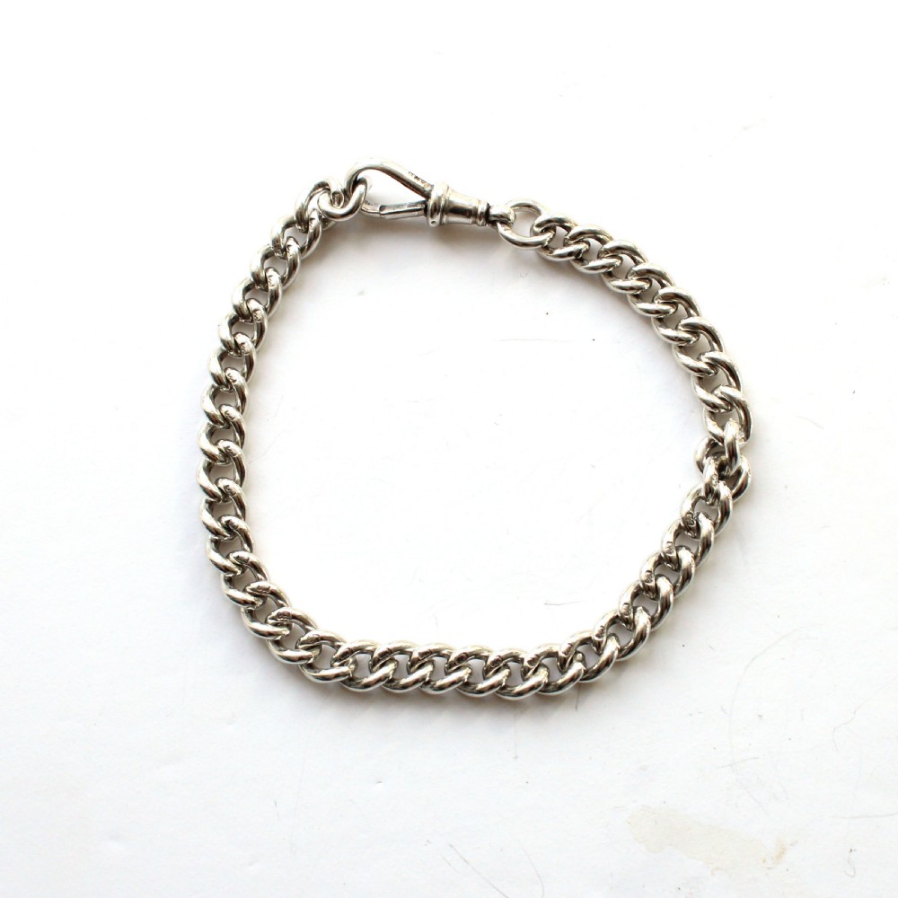 Solid silver chain bracelet featuring interlinked links secured with a dog clip swivel clasp.