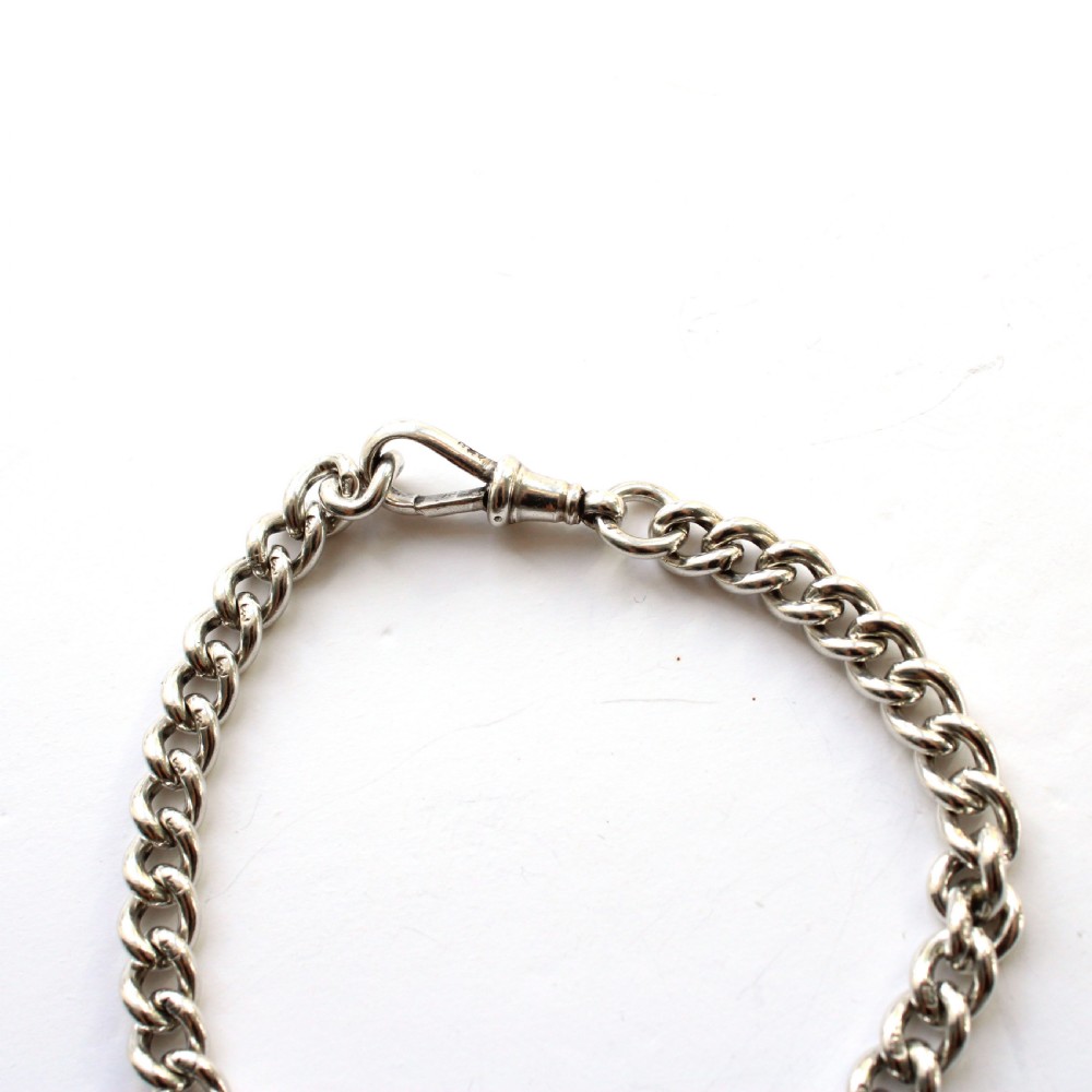 Solid silver chain bracelet featuring interlinked links secured with a dog clip swivel clasp. View IV