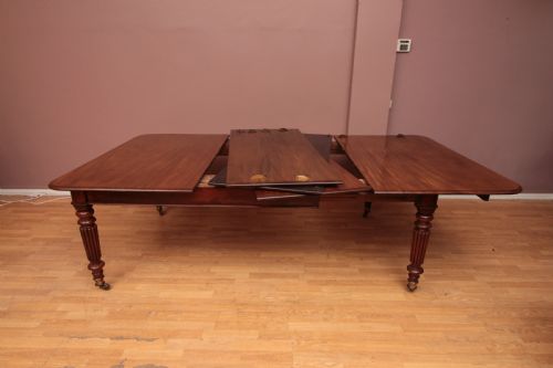 A CUBAN MAHOGANY EXTENDING DINING TABLE - ADDITIONAL PHOTO 8