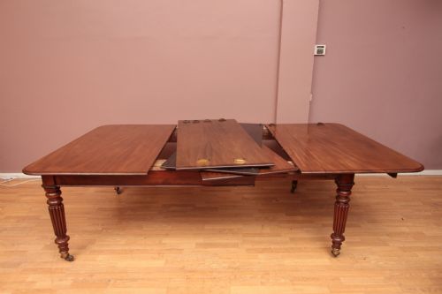 A CUBAN MAHOGANY EXTENDING DINING TABLE - ADDITIONAL PHOTO 9