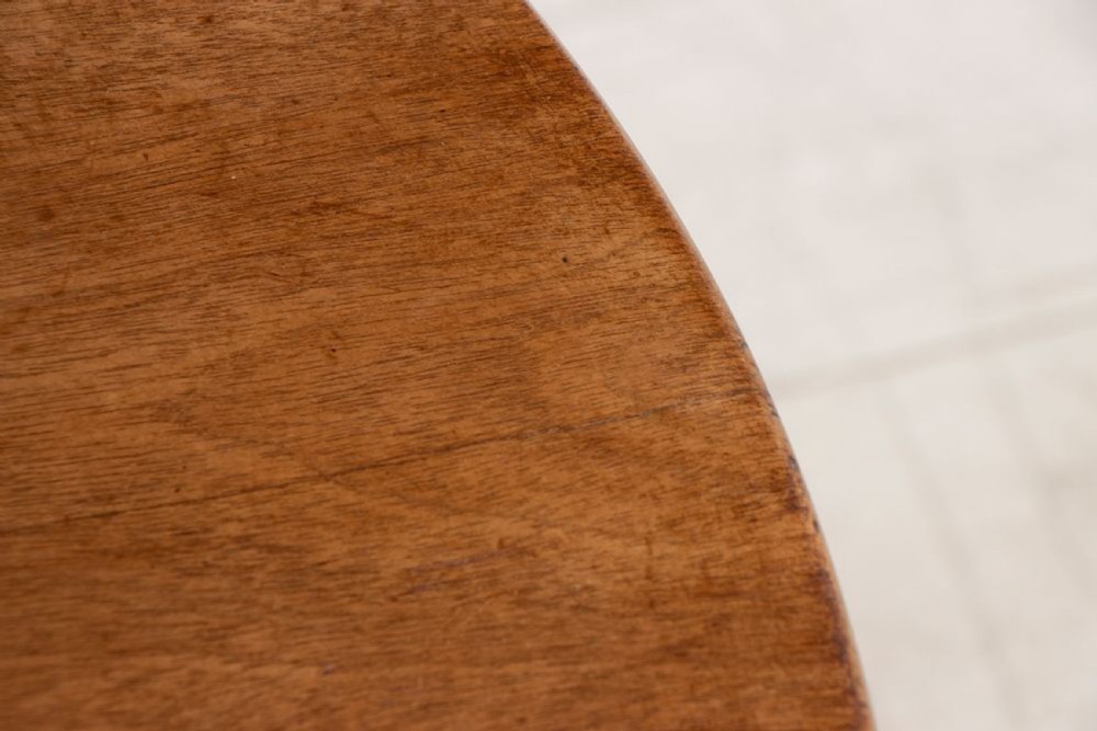 An eighteenth-century circular mahogany tilt-top table featuring a birdcage mechanism, turned central stem, and tripod cabriole legs. View VII