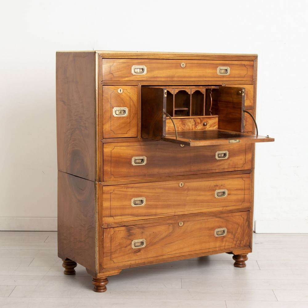 An antique 19th-century camphorwood military campaign secretaire chest featuring flush brass handles, geometric drawer borders, and turned feet. View II