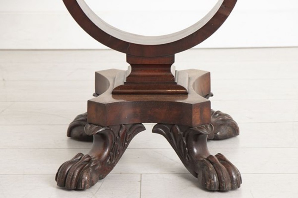 A small Georgian mahogany side table featuring drop leaves, two front drawers, a curved U-shaped support, and carved claw feet. View VI