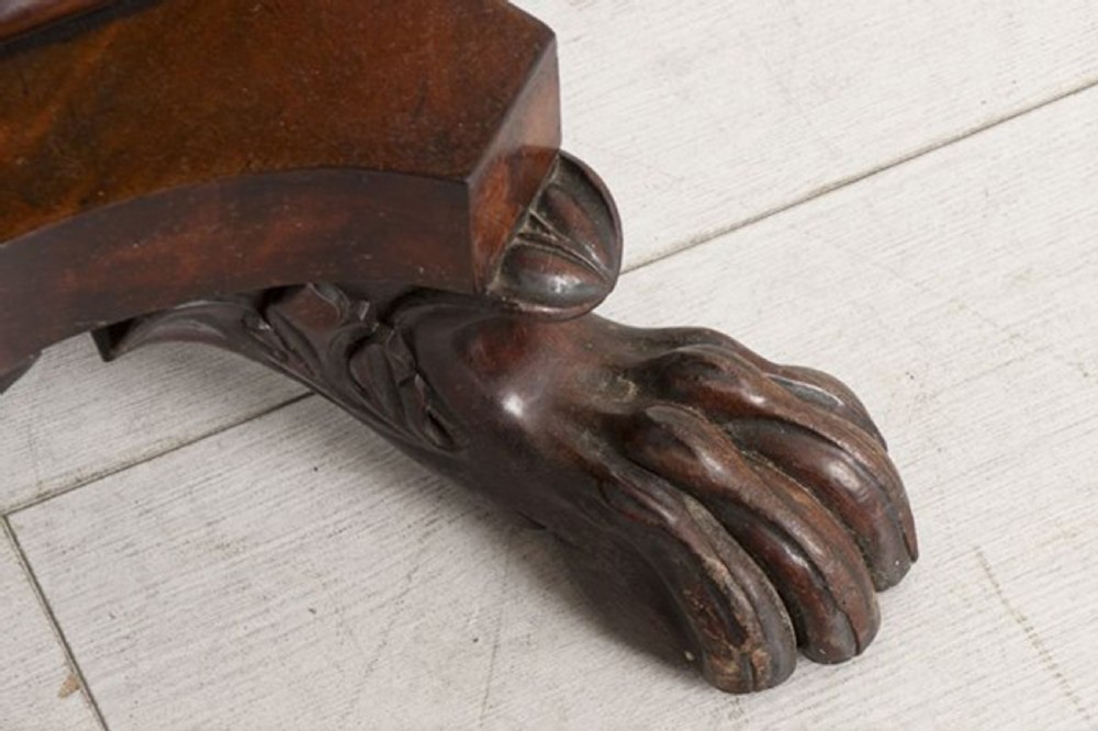 A small Georgian mahogany side table featuring drop leaves, two front drawers, a curved U-shaped support, and carved claw feet. View VIII