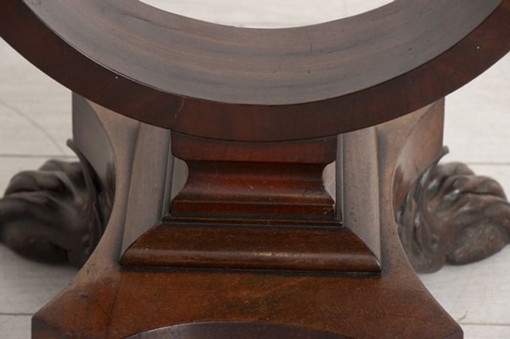 A small Georgian mahogany side table featuring drop leaves, two front drawers, a curved U-shaped support, and carved claw feet. View XVI