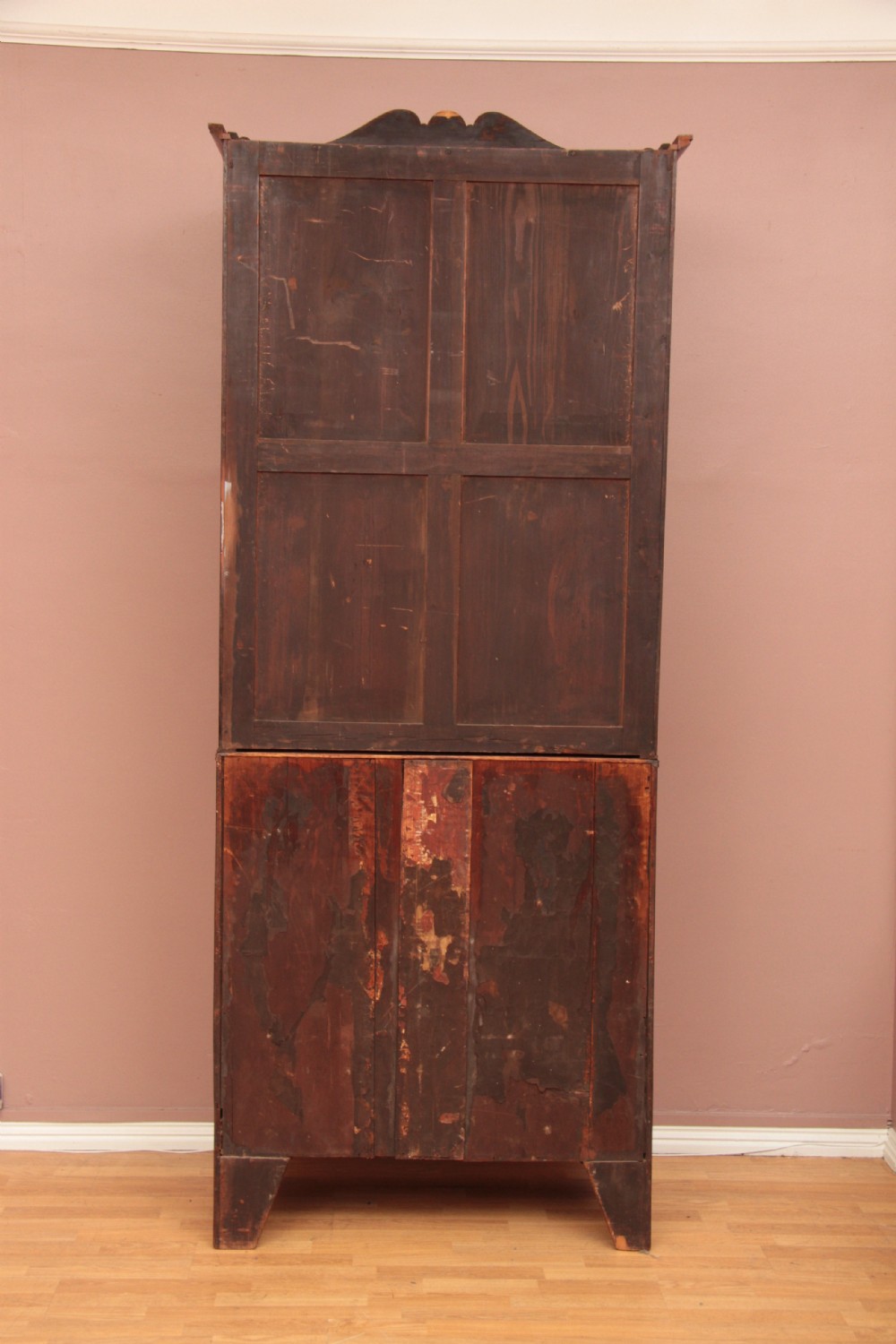 An antique dark mahogany bureau bookcase featuring a shaped pediment, twin astragal glazed doors, and four lower drawers with oval brass handles. View XIII