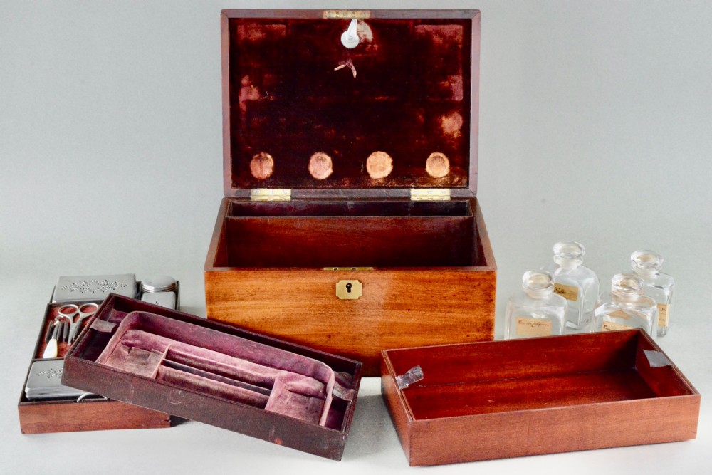 A rectangular Victorian mahogany dressing box featuring a brass keyhole escutcheon and lid cartouche. View II