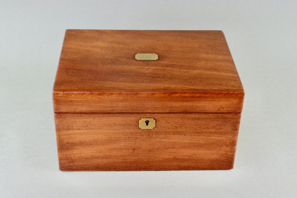A rectangular Victorian mahogany dressing box featuring a brass keyhole escutcheon and lid cartouche. View III