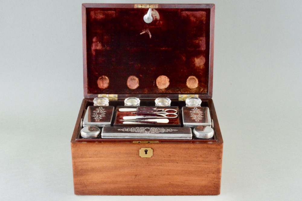 A rectangular Victorian mahogany dressing box featuring a brass keyhole escutcheon and lid cartouche. View IV
