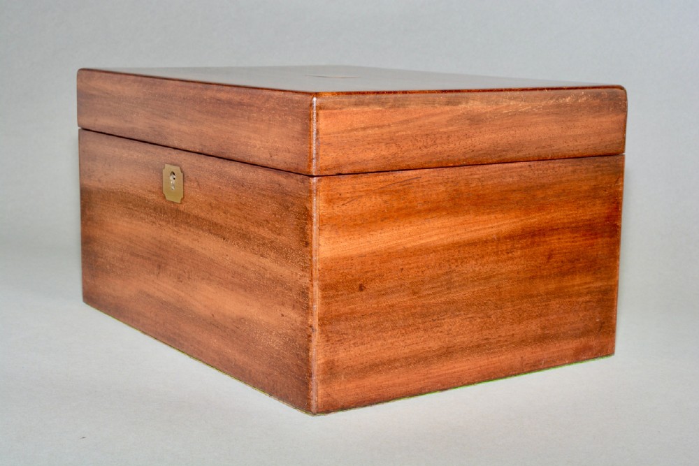 A rectangular Victorian mahogany dressing box featuring a brass keyhole escutcheon and lid cartouche. View V