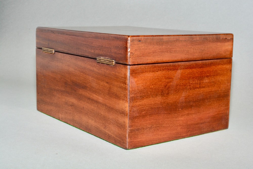 A rectangular Victorian mahogany dressing box featuring a brass keyhole escutcheon and lid cartouche. View VI