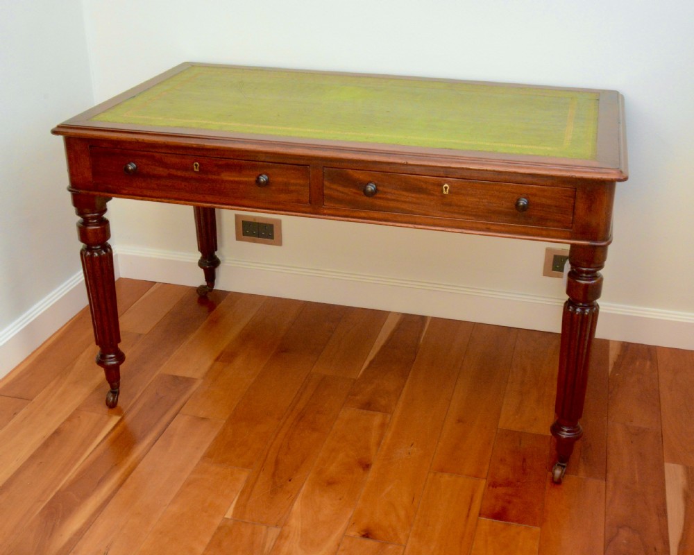 An early Victorian fiddle back mahogany two Drawer Circa 1860 reeded legged leather inset writing table View II
