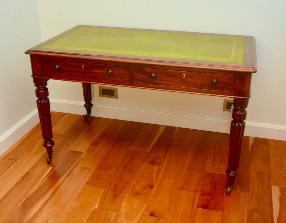 An early Victorian fiddle back mahogany two Drawer Circa 1860 reeded legged leather inset writing table View III