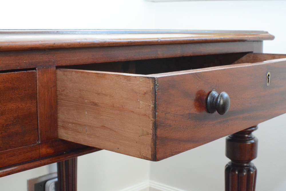 An early Victorian fiddle back mahogany two Drawer Circa 1860 reeded legged leather inset writing table View VI