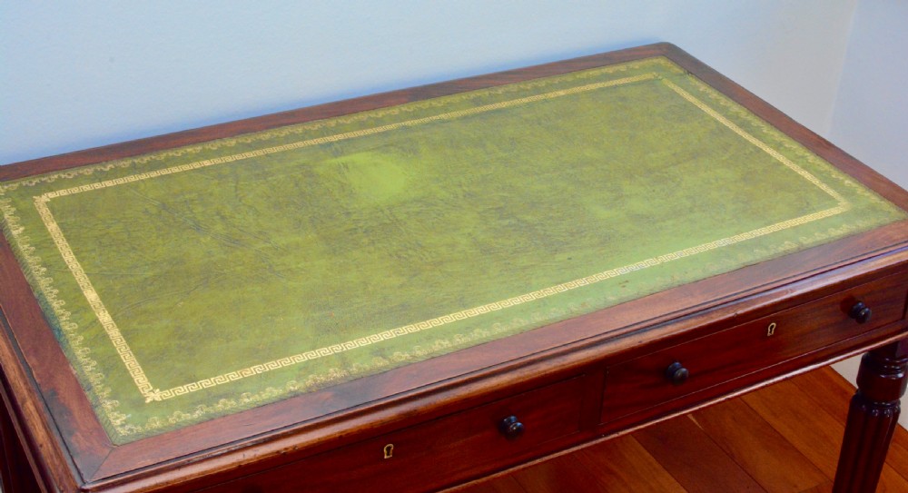 An early Victorian fiddle back mahogany two Drawer Circa 1860 reeded legged leather inset writing table View VII