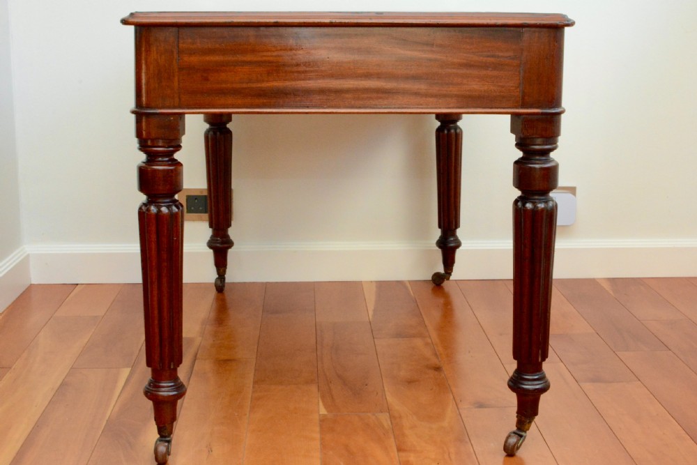 An early Victorian fiddle back mahogany two Drawer Circa 1860 reeded legged leather inset writing table View VIII
