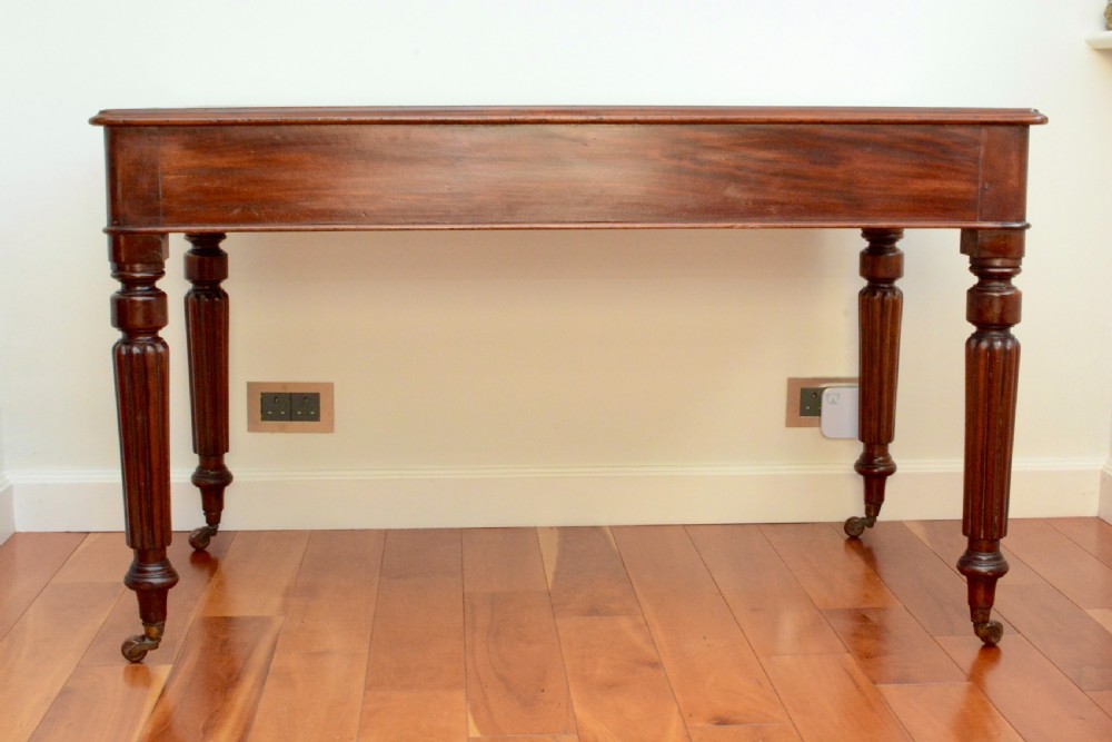 An early Victorian fiddle back mahogany two Drawer Circa 1860 reeded legged leather inset writing table View IX