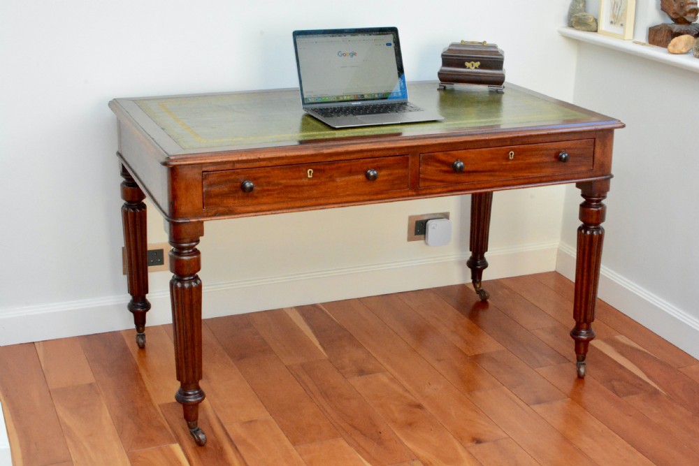 An early Victorian fiddle back mahogany two Drawer Circa 1860 reeded legged leather inset writing table View XI