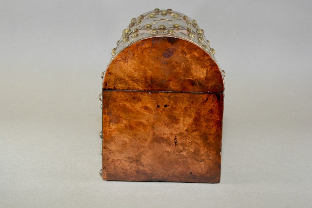 A Victorian dome-topped figured walnut stationery box featuring ornate pierced brass mounts and studs. View VI
