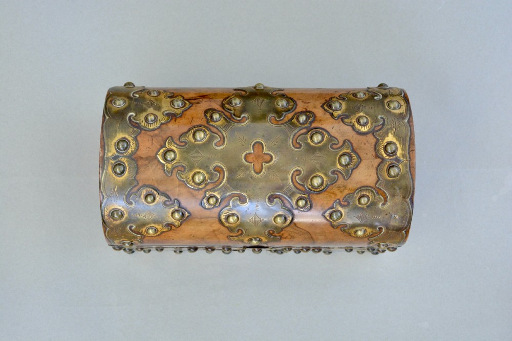 A Victorian dome-topped figured walnut stationery box featuring ornate pierced brass mounts and studs. View VIII