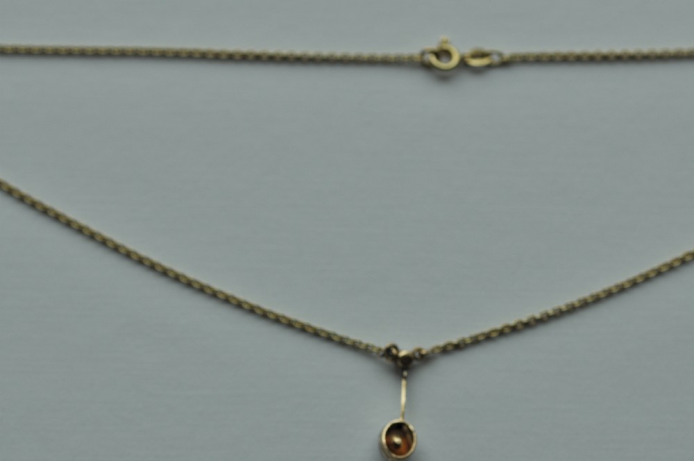 A Foil Back 0.7ct Diamond Pendant and Chain View II